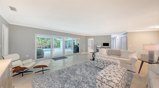 living room with light tile patterned flooring and crown molding