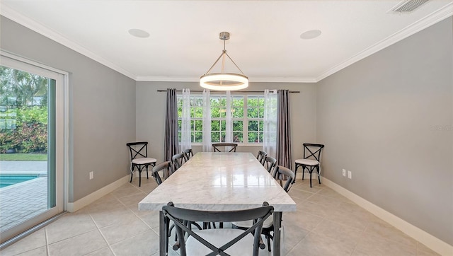 dining space featuring light tile patterned floors, plenty of natural light, and ornamental molding