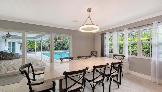 dining room featuring ceiling fan, light tile patterned floors, and ornamental molding