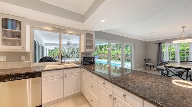 kitchen featuring white cabinets, dishwasher, sink, ceiling fan, and light tile patterned floors