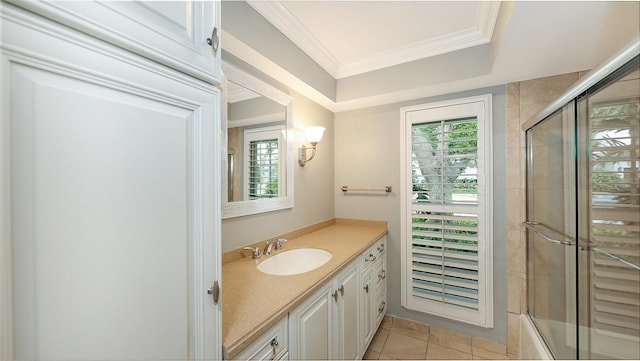 bathroom featuring vanity, tile patterned flooring, shower / bath combination with glass door, and ornamental molding