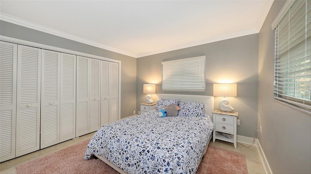 bedroom with a closet, ornamental molding, and tile patterned floors