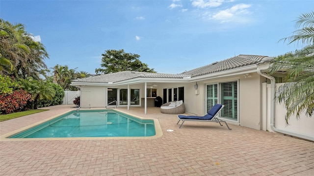 view of swimming pool with a patio