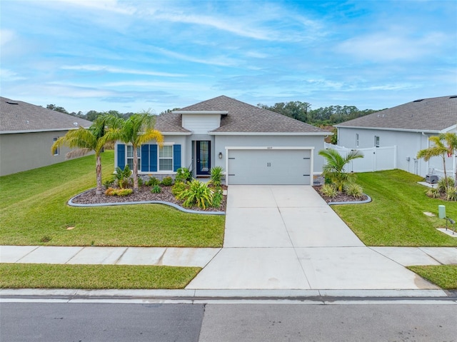 view of front of house with a front lawn and a garage