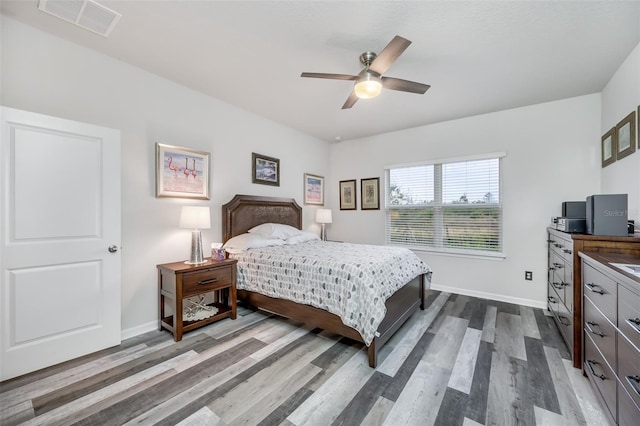 bedroom featuring hardwood / wood-style floors and ceiling fan