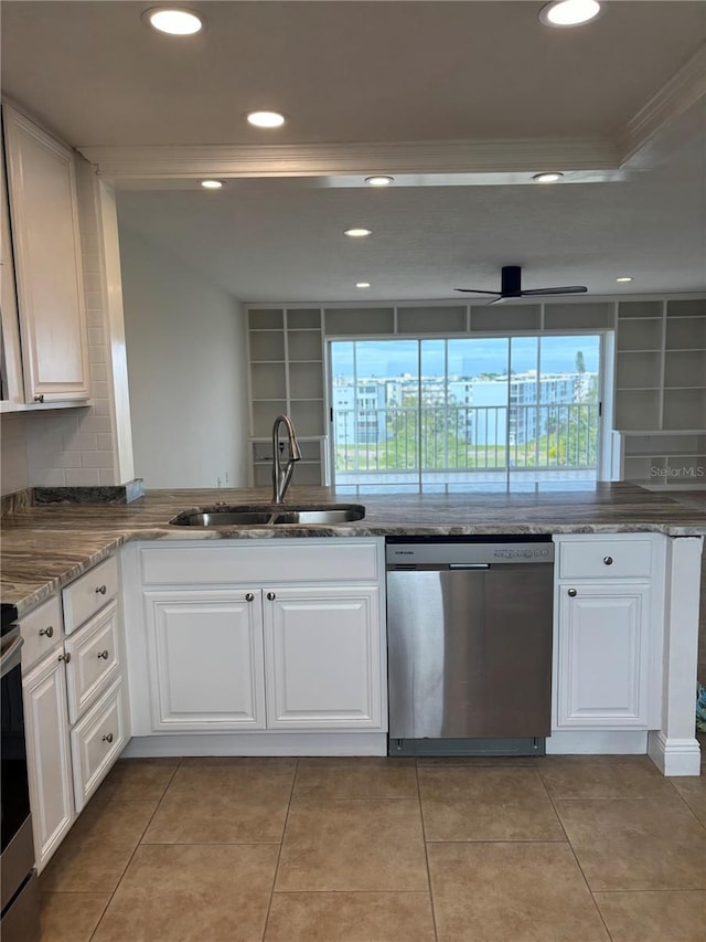 kitchen with ceiling fan, stainless steel dishwasher, sink, white cabinetry, and ornamental molding