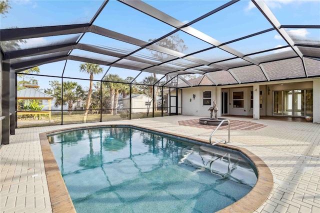 view of pool featuring a lanai and a patio area