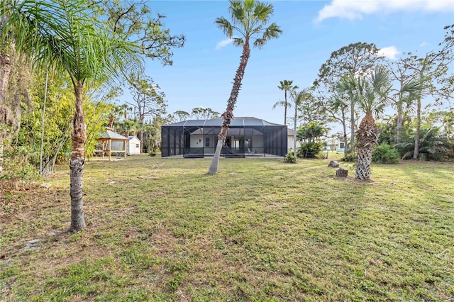 view of yard featuring glass enclosure