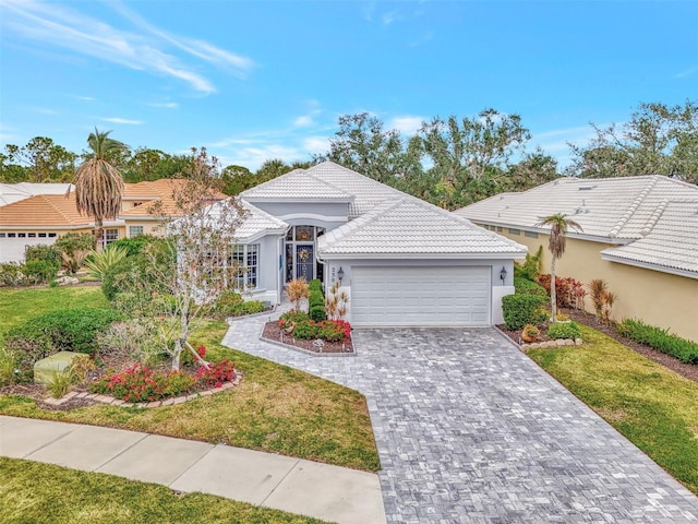230 Vestavia Dr, Venice, FL 34292 - view of front facade with a front yard and a garage