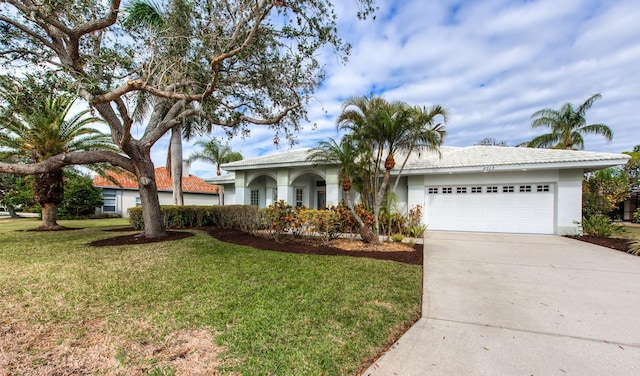 ranch-style home with a garage and a front lawn