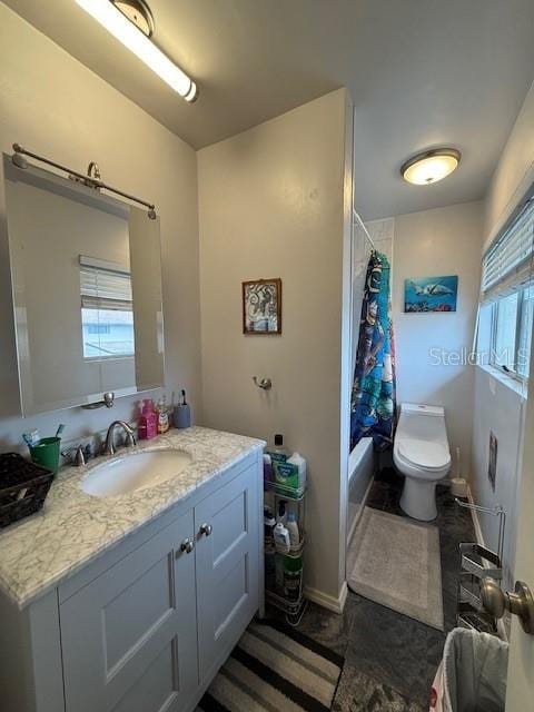 full bathroom featuring toilet, vanity, and shower / bathtub combination with curtain