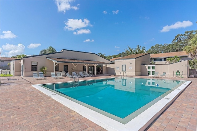 view of swimming pool featuring a patio