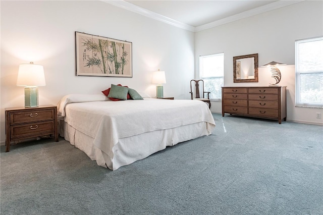 bedroom with crown molding and light colored carpet