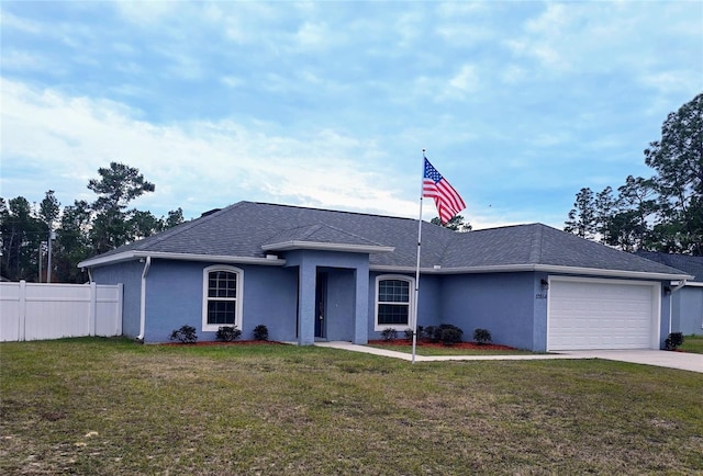 ranch-style home with a garage and a front yard