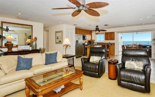 living area with visible vents and recessed lighting