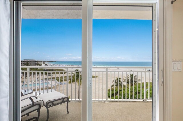 balcony with a beach view and a water view