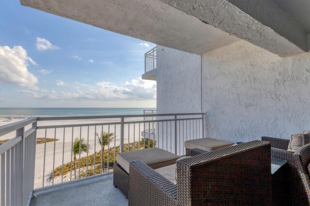 balcony with a view of the beach and a water view