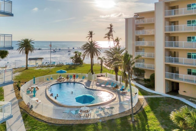 view of swimming pool with a water view