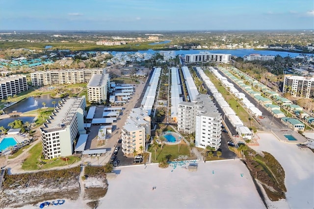 drone / aerial view featuring a water view and a city view