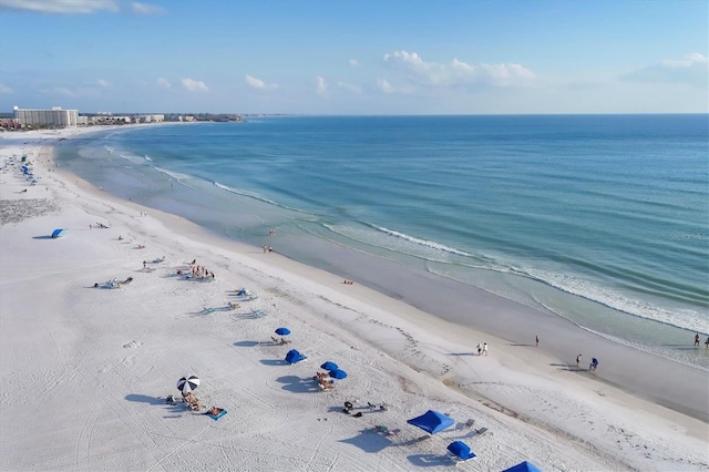 birds eye view of property with a water view and a view of the beach