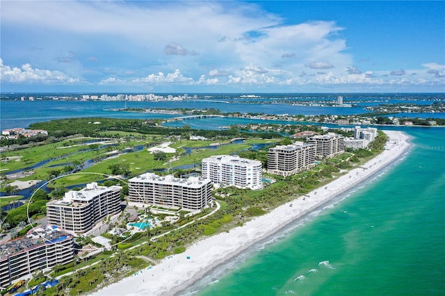 birds eye view of property featuring a water view and a view of the beach