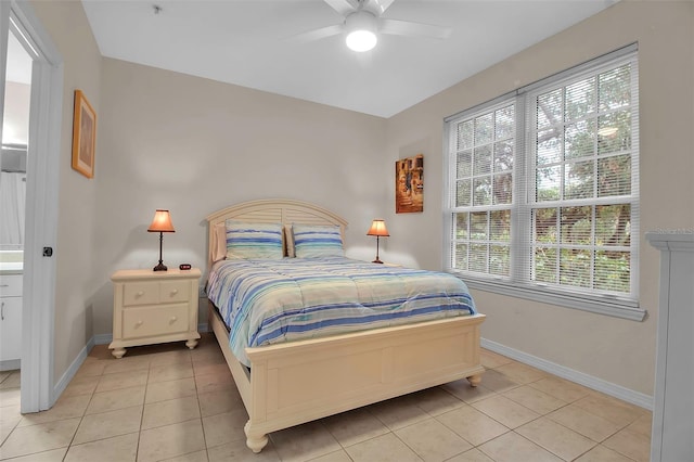 bedroom featuring light tile patterned flooring and ceiling fan