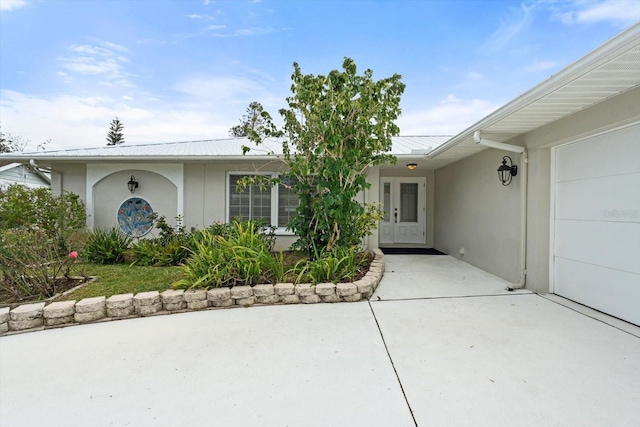 property entrance with a garage