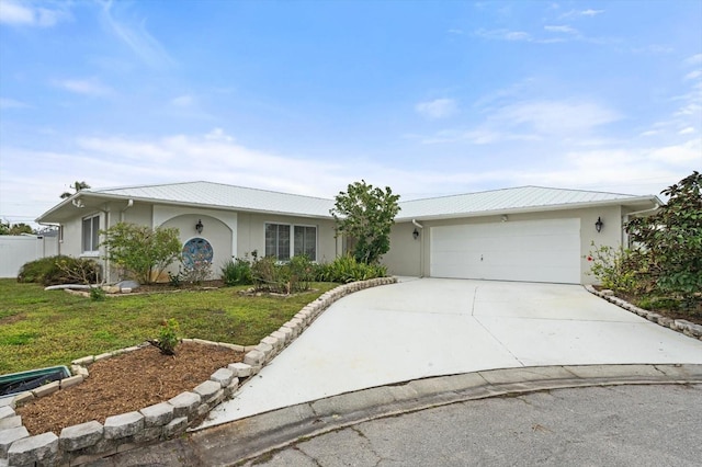 ranch-style house featuring a garage and a front yard