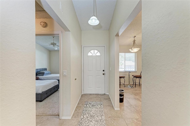 foyer with a textured ceiling