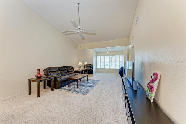 carpeted living room featuring high vaulted ceiling and ceiling fan