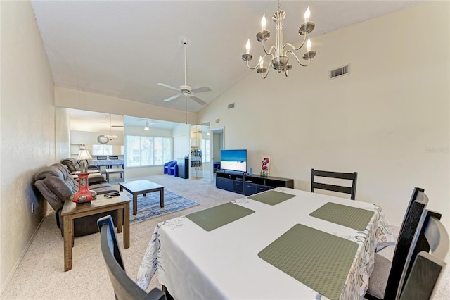 dining area featuring light carpet, ceiling fan with notable chandelier, and high vaulted ceiling