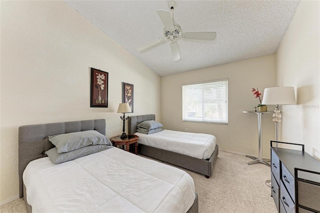 carpeted bedroom featuring vaulted ceiling, ceiling fan, and a textured ceiling