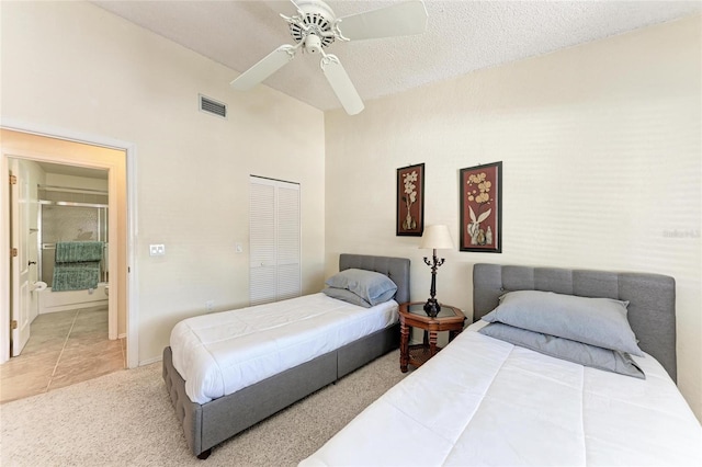 bedroom featuring high vaulted ceiling, a closet, ceiling fan, and carpet flooring