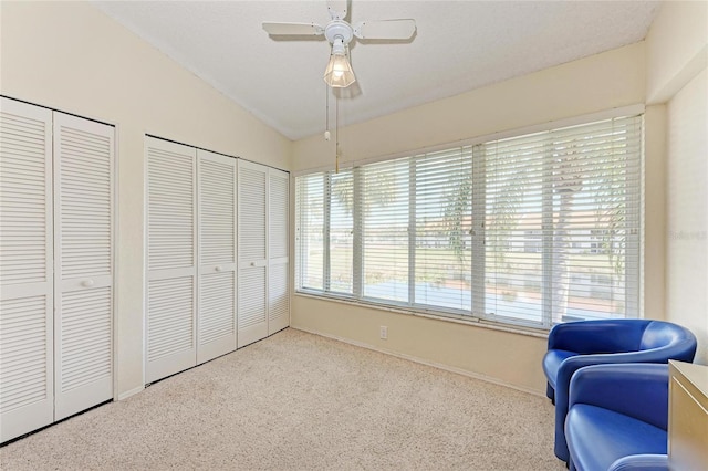 sitting room featuring vaulted ceiling, carpet floors, and ceiling fan