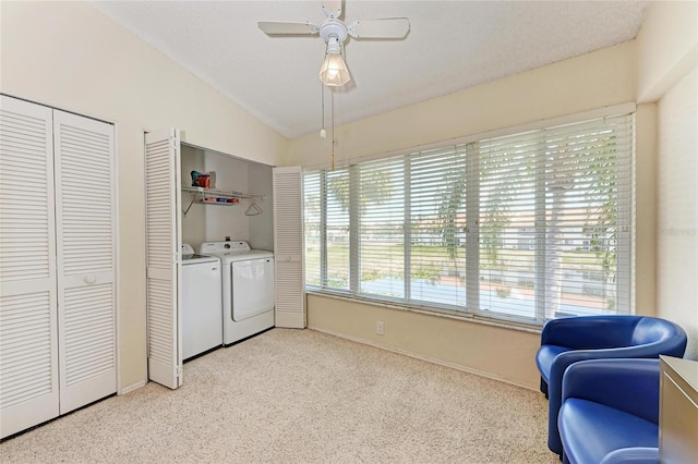 washroom with a textured ceiling, washer and clothes dryer, and ceiling fan