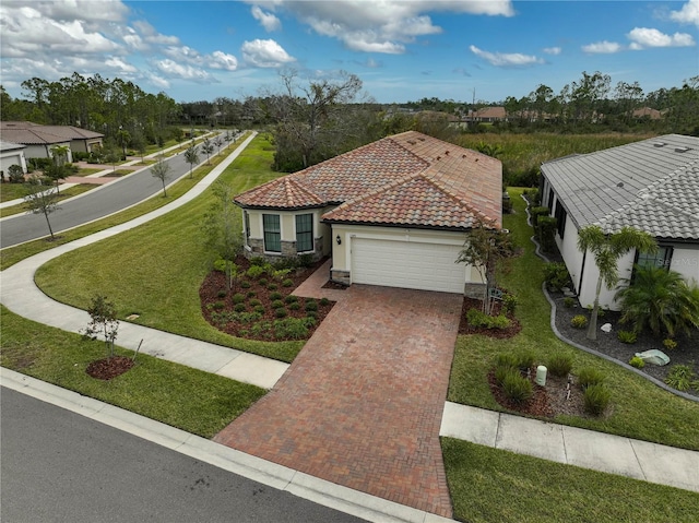 view of front of house with a front yard and a garage