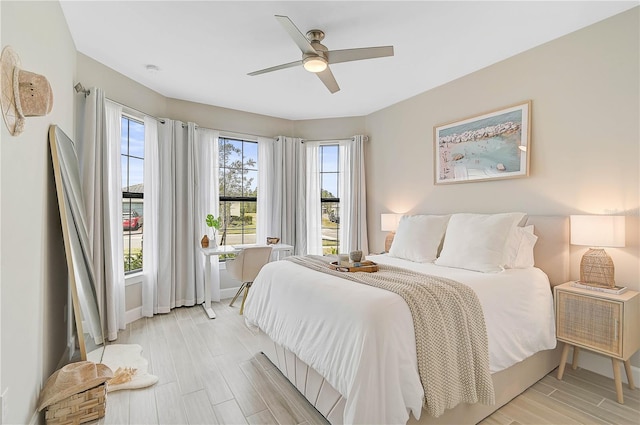 bedroom featuring ceiling fan and light hardwood / wood-style floors