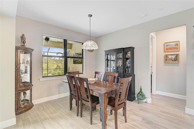 dining space with light wood-type flooring