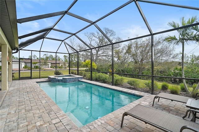 view of swimming pool with glass enclosure, an in ground hot tub, and a patio