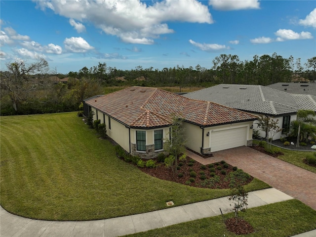 view of front of property with a garage and a front yard