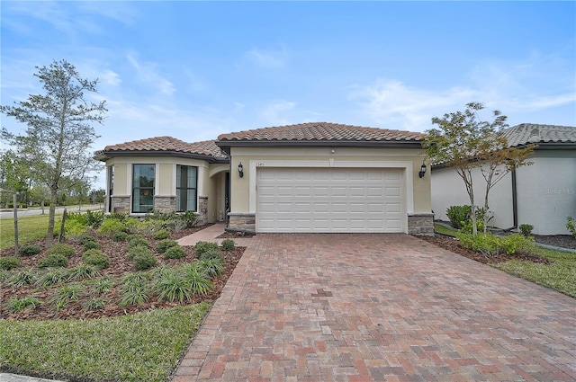 mediterranean / spanish-style house featuring a garage