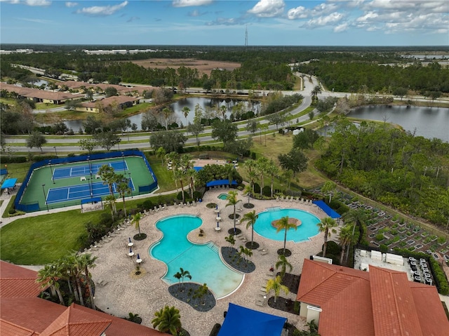 view of pool featuring a patio area and a water view