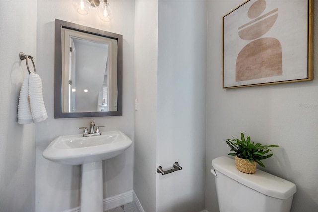 bathroom with sink and toilet