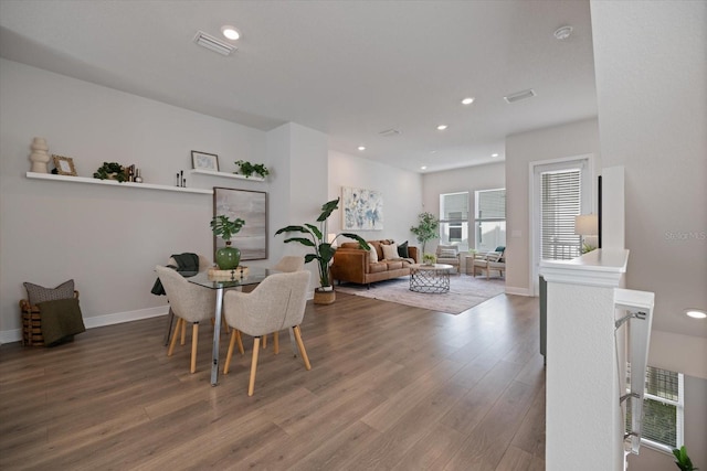 dining room with hardwood / wood-style flooring