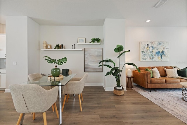 dining room with dark hardwood / wood-style floors