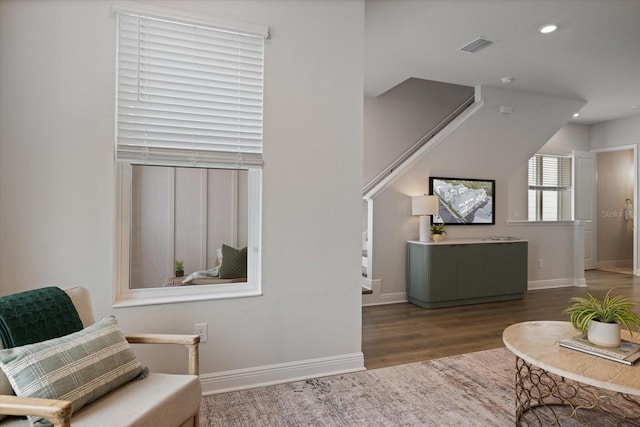 living area with dark hardwood / wood-style flooring