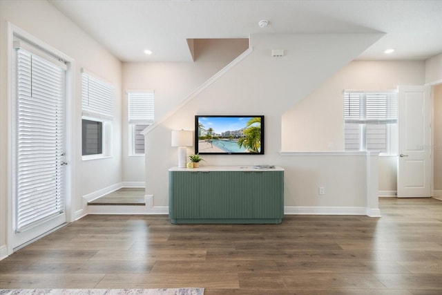 unfurnished living room with hardwood / wood-style flooring