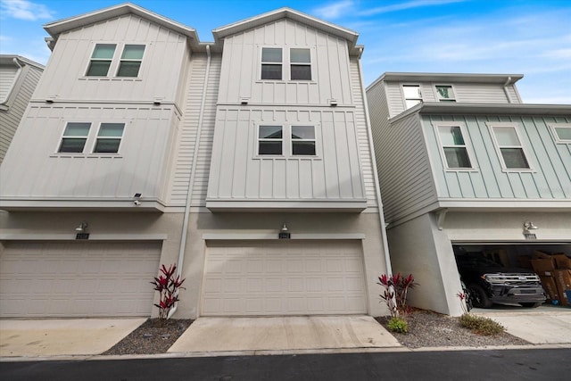 multi unit property featuring a garage