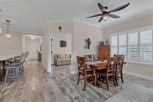 dining room featuring ceiling fan, ornamental molding, and light hardwood / wood-style floors