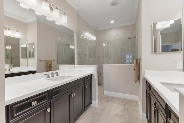 bathroom with crown molding, vanity, and a tile shower